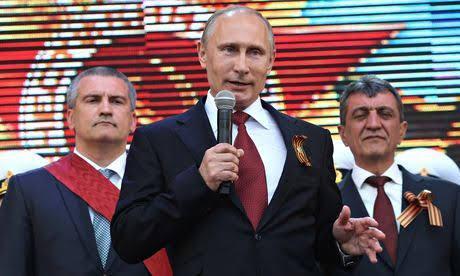 Putin wears St. George Ribbon to participate in the event